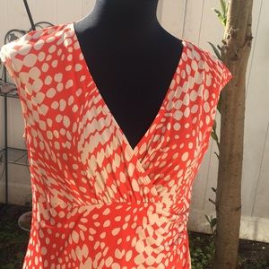 Nice orange and creme dress.